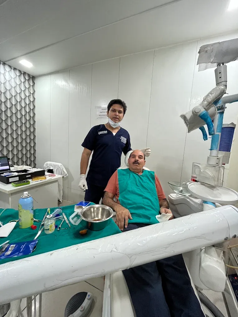 Dr. Ankur Saxena with a patient in the treatment room